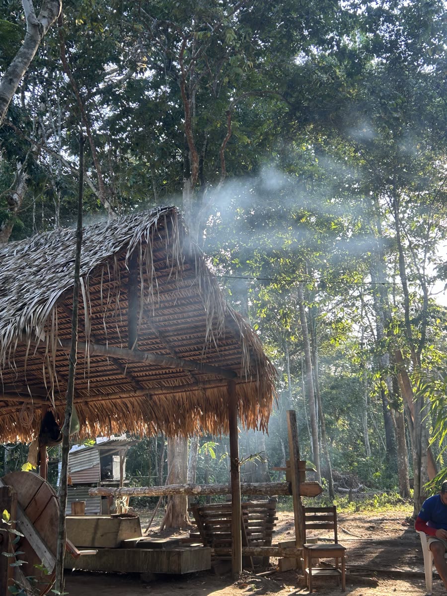 Riverside thatched kitchen in the forest